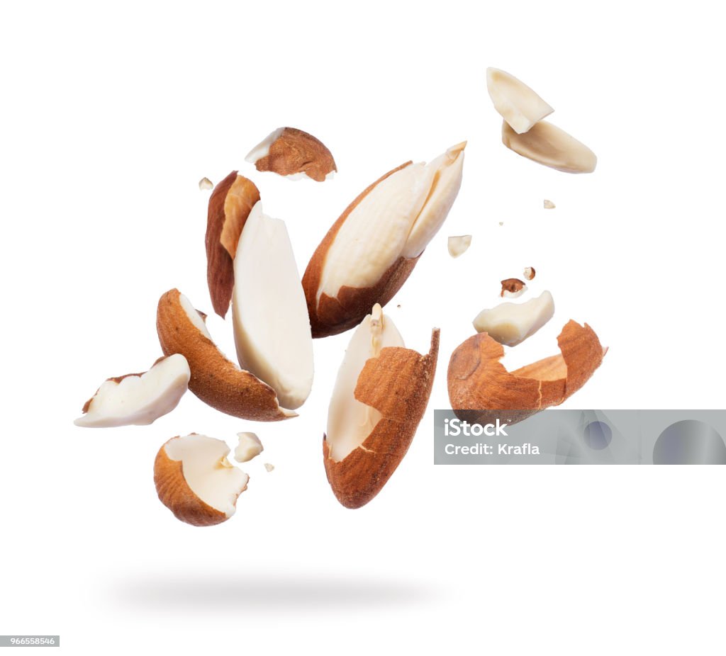 Almonds crushed into pieces close-up on white background Almond Stock Photo