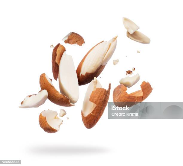 Almonds Crushed Into Pieces Closeup On White Background Stock Photo - Download Image Now