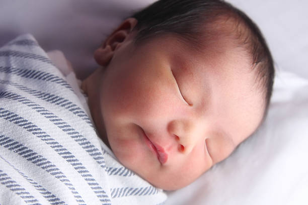 istock Close-up of a sleeping newborn baby's face 96656098