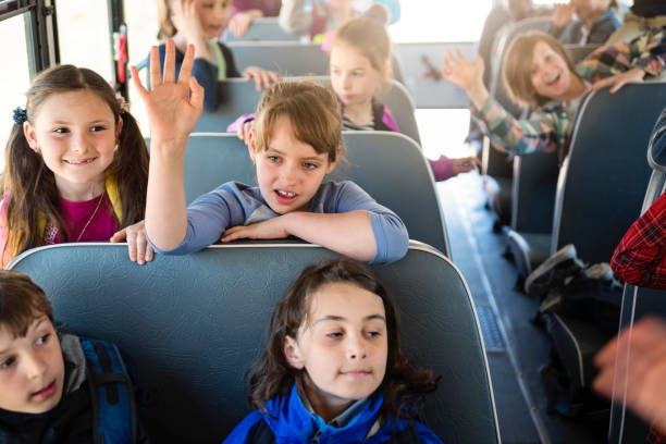 istock Large group of kids sitting on school bus. 966567298