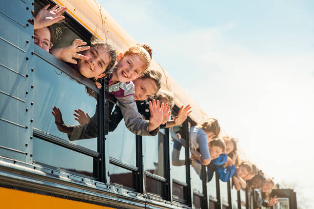 istock Kids saying goodbye on school bus. 966567554