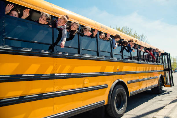 istock Kids saying goodbye on school bus. 966567602