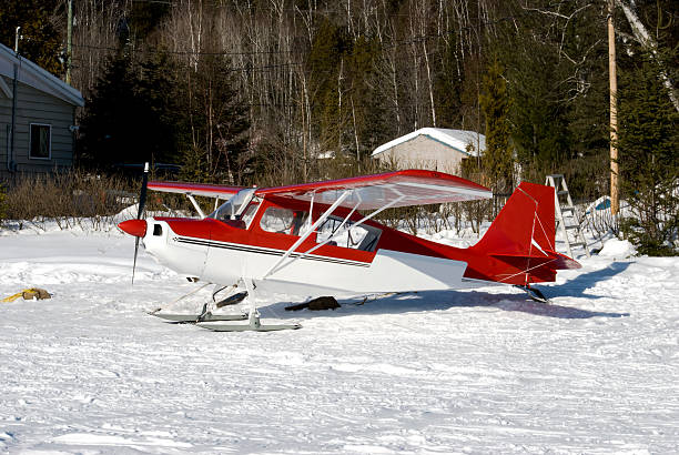 A small propeller airplane on the runway about to take off