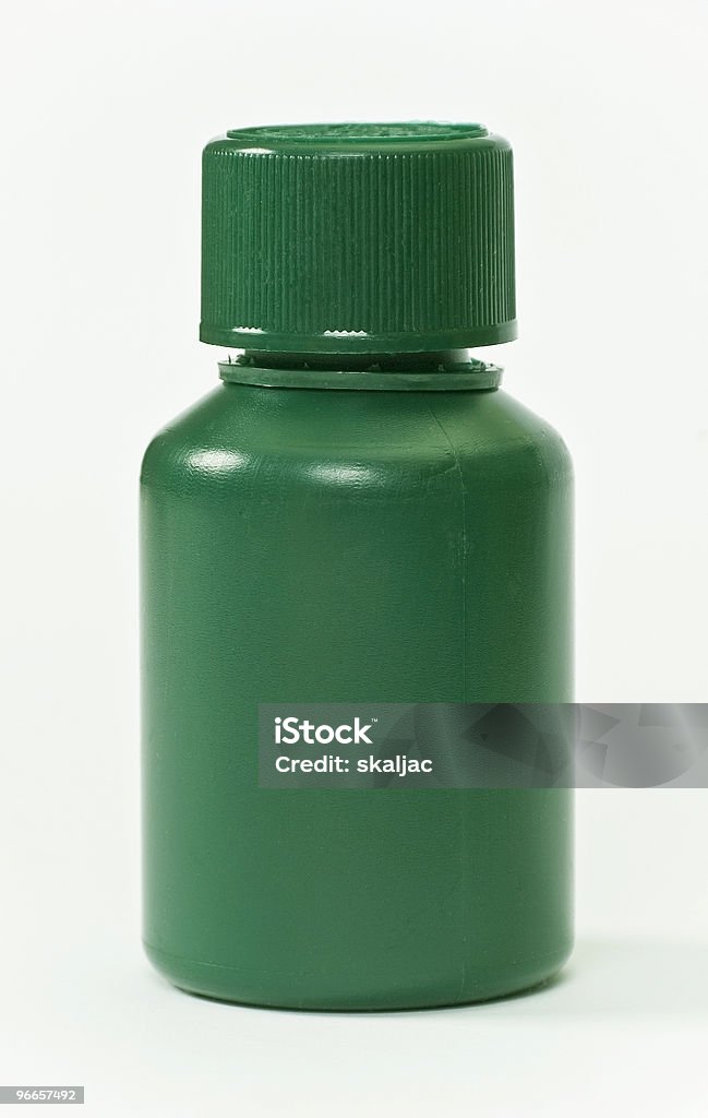 Plastica verde bottiglia di pillole - Foto stock royalty-free di Benessere