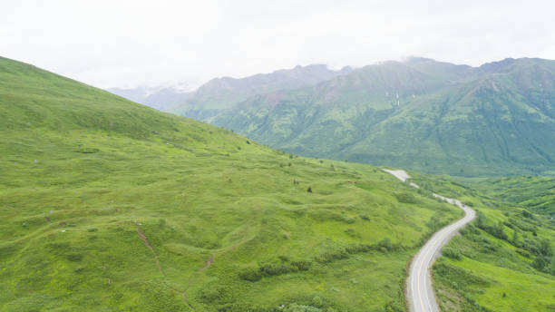 istock A highway snakes through an Alaskan pass between the mountains 966578408