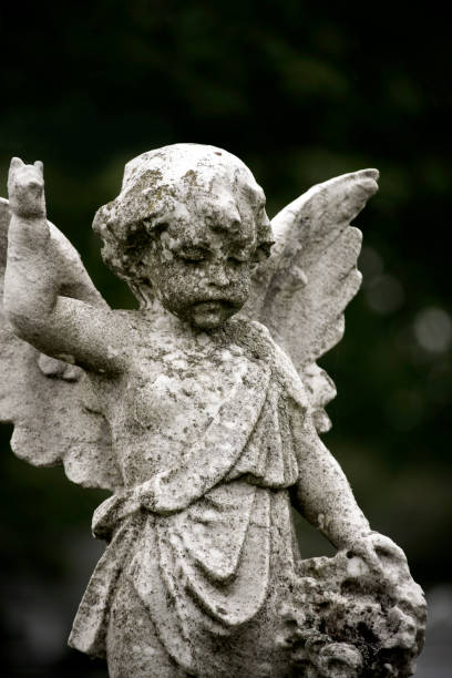 istock Statue of a Cherub in the cemetery 966587304