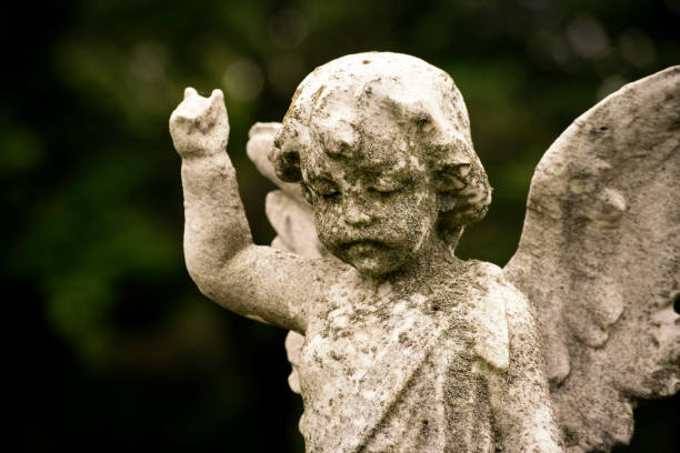 istock Statue of a Cherub in the cemetery 966587346