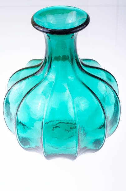 Interior green glass vase for flowers. Studio Photo