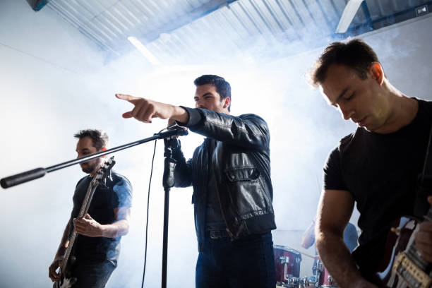 istock Performing a rock song on stage 966643550