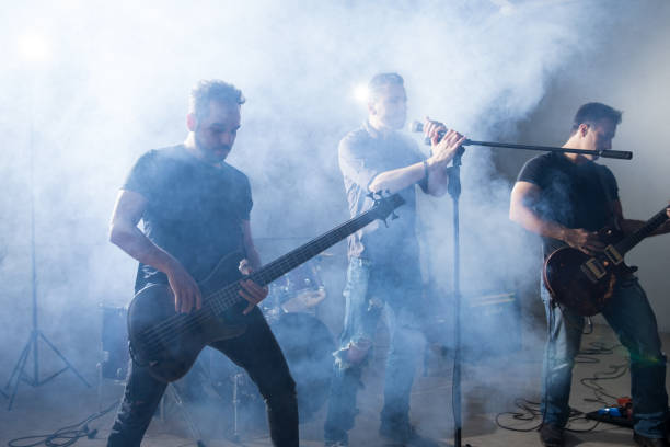 istock Rock singer and guitarists on stage 966649274