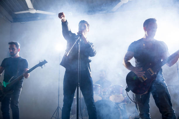 istock Rock band playing on a concert 966649486