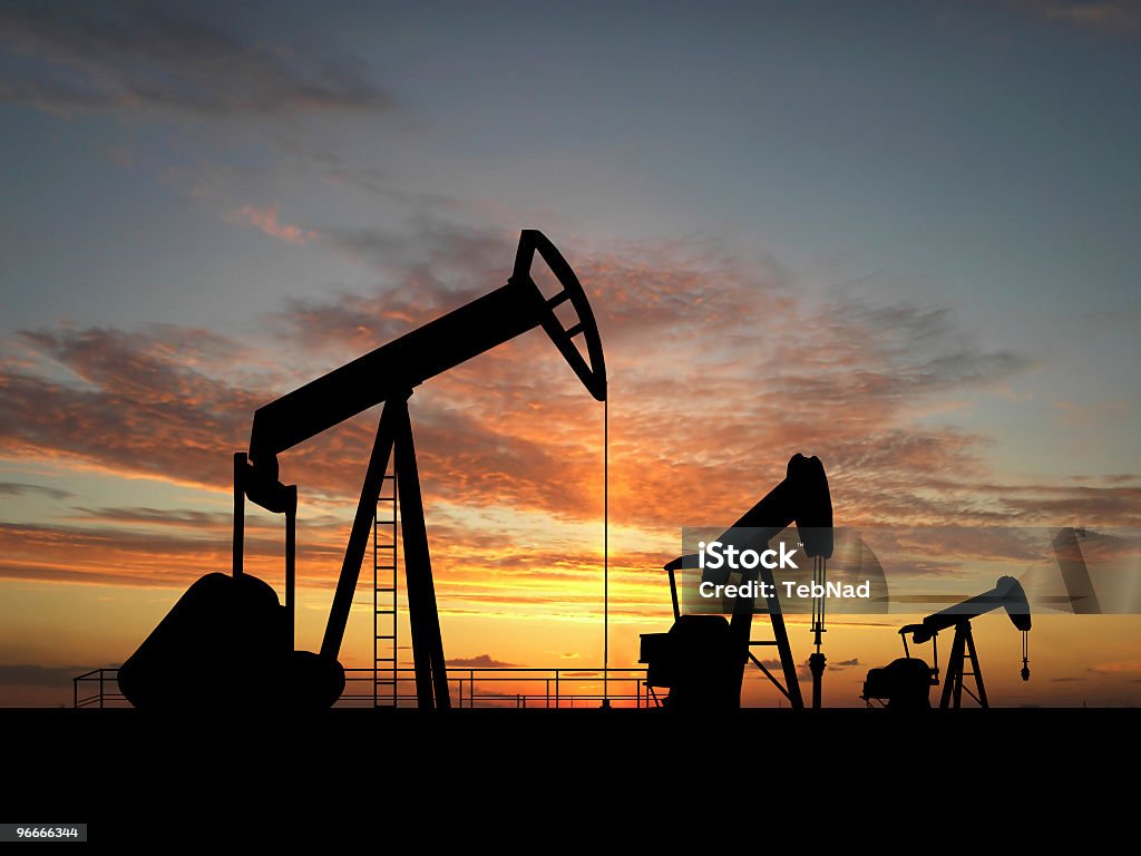 Silhouette oil pumps  Oil Pump Stock Photo