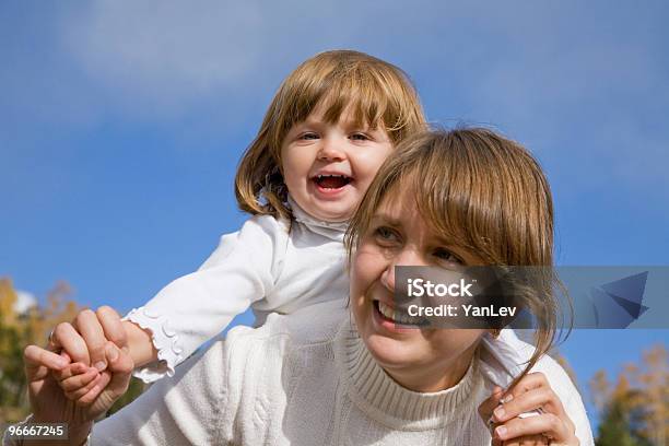 Mother With Daughter Stock Photo - Download Image Now - Adult, Autumn, Blue