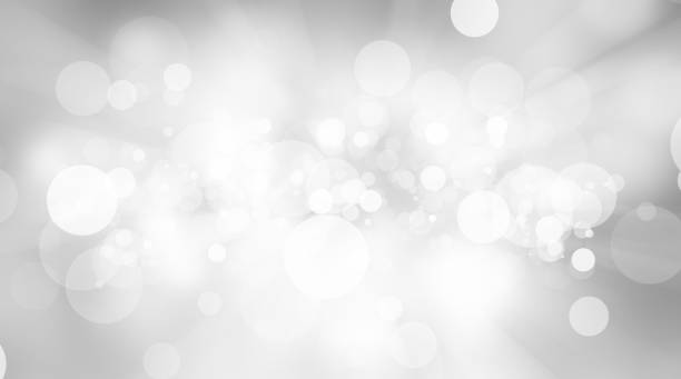 istock white blur abstract background. bokeh christmas blurred beautiful shiny Christmas lights 966677156