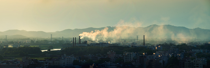 Industrial smokestacks and cities