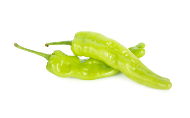 istock fresh green chili peppers with stem on white background 966679778
