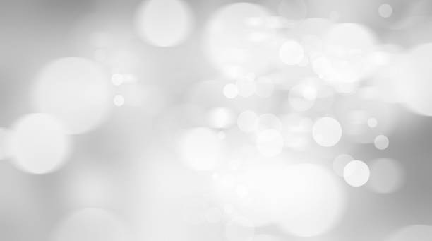istock white blur abstract background. bokeh christmas blurred beautiful shiny Christmas lights 966679818