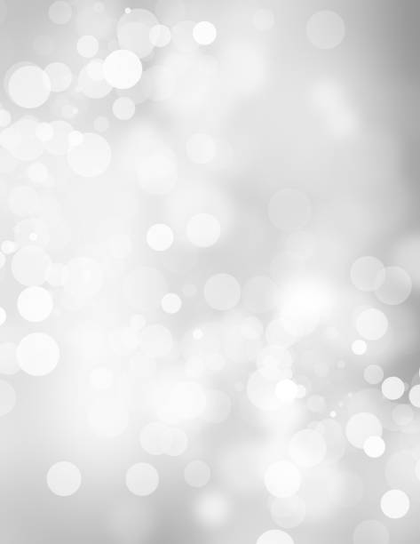 istock white blur abstract background. bokeh christmas blurred beautiful shiny Christmas lights 966682162