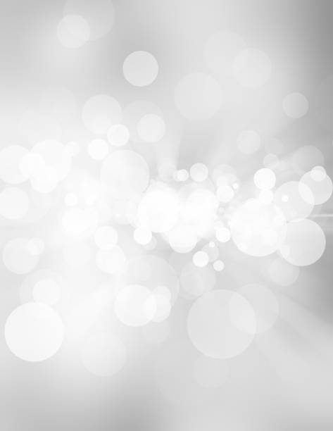 istock white blur abstract background. bokeh christmas blurred beautiful shiny Christmas lights 966689440
