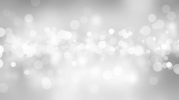 istock white blur abstract background. bokeh christmas blurred beautiful shiny Christmas lights 966689628