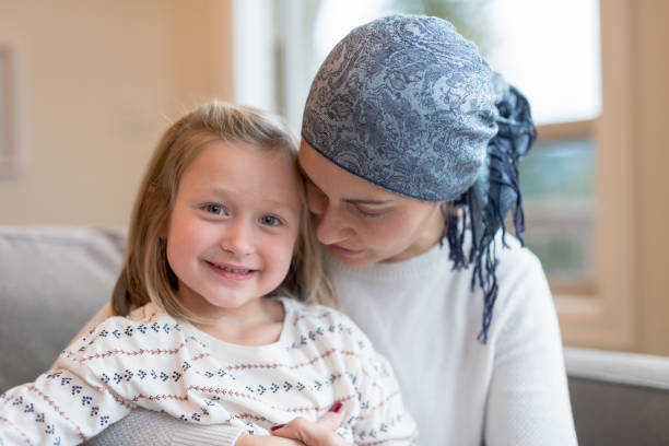 istock Young mom with cancer holds her daughter 966689726