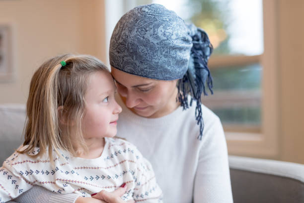 istock Young mom with cancer holds her daughter 966689730