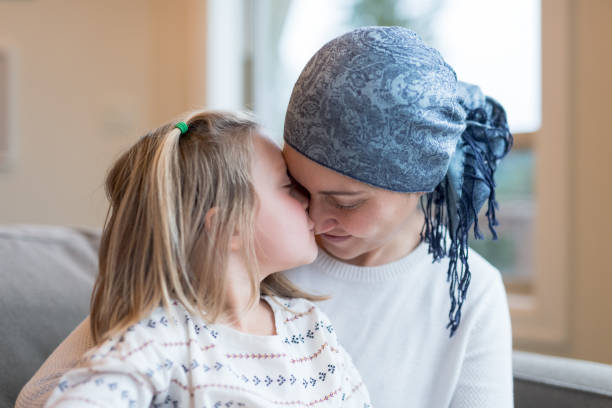 istock Young mom with cancer holds her daughter 966689734