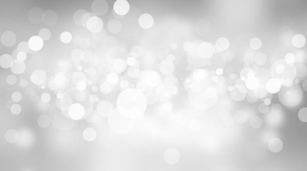 istock white blur abstract background. bokeh christmas blurred beautiful shiny Christmas lights 966691878