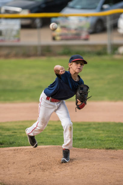 istock Throwing his best pitch from the mound. 966696880