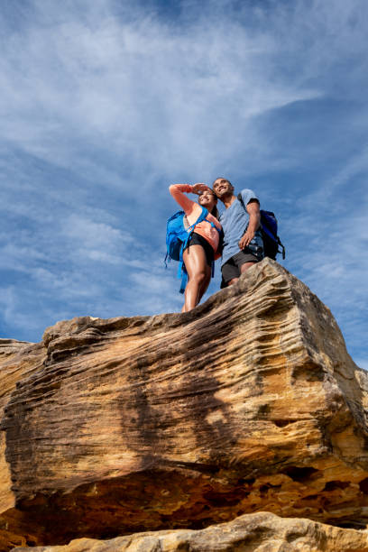istock Happy couple hiking and looking at the view 966705996
