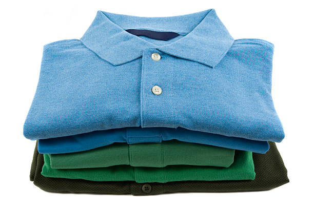 Pile of polo shirts folded neatly stock photo