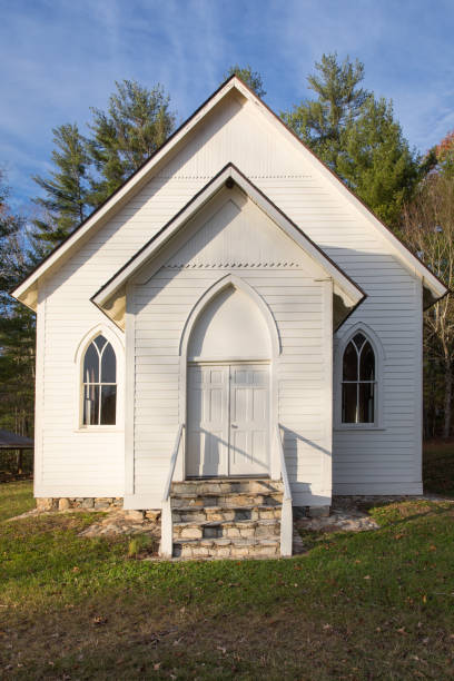 istock White Country Church against a blue sky 966712228