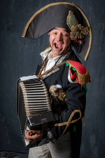 istock Singing Commedia dell Arte performer in il Capitano costume performs with his accordion. 966721990