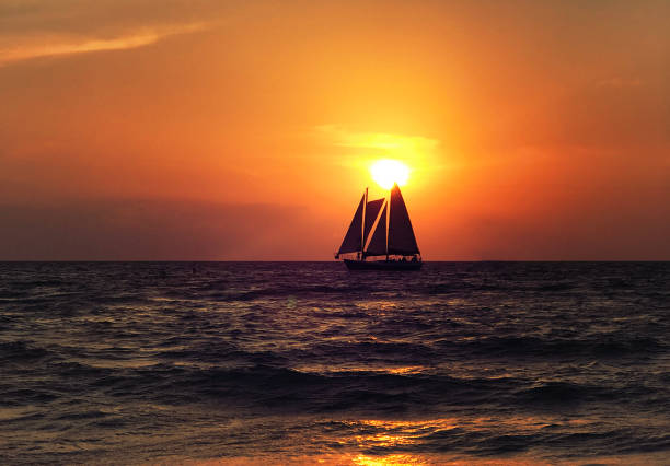 istock Sunset and Sailboat. Photo Image 966728994