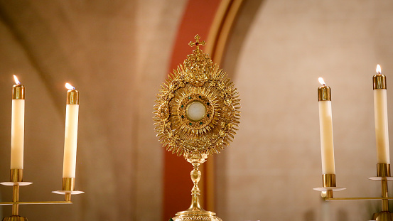 Eucharistic Adoration in Monstrance, Candles Burning in Catholic Church