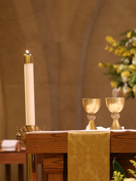 istock Catholic Church Candles, Wine Chalice on Altar 966732704