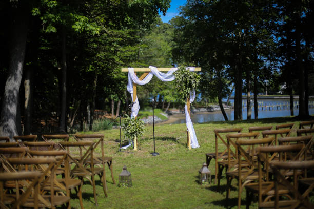 istock Wooden Wedding Altar Draped in White Fabric with Greenery Garland Decorations 966732954