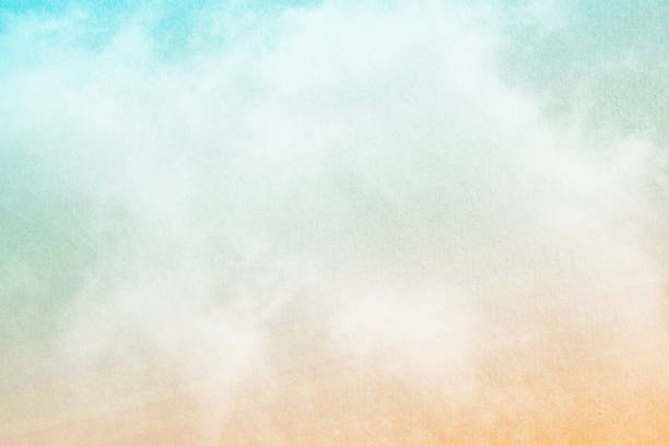 istock cloudy sky with pastel gradient color and grunge paper texture, nature abstract background 966739094