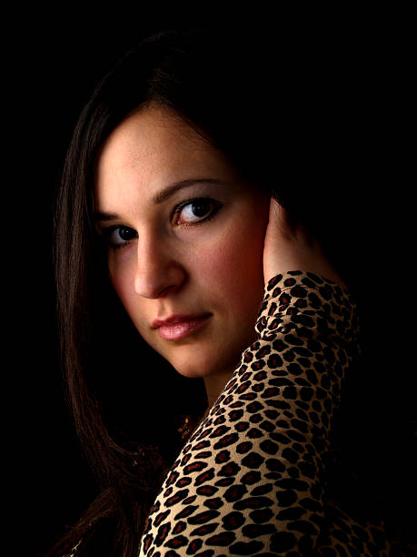 istock Young brunette on black touching hair 96674538
