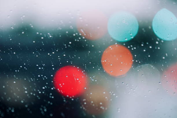 istock Full Frame Shot Of Wet Window Against Illuminated Lights 966746134