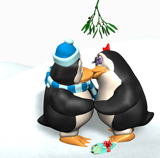 Close-up of penguin hanging on Cristmas tree agains white branches