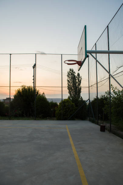 istock Sunset at the basketball court 966749608