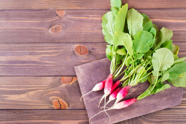 istock Fresh ripe washed radish on a cutting board on a wooden table 966757226