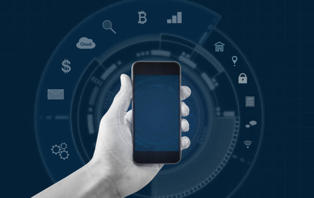istock Hand holding mobile smart phone, and application icons background 966757906