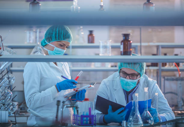 istock Two microbiologists working on genetic research in a laboratory. 966769026