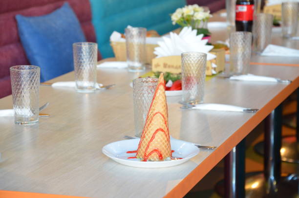 istock Table with plates and glasses before a party 966774772