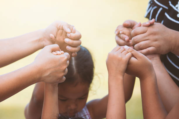 istock Children and parent holding hands and playing together with unity and teamwork 966783128