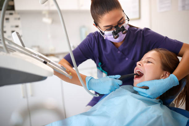 istock Dentist repair girls’ teeth 966786670
