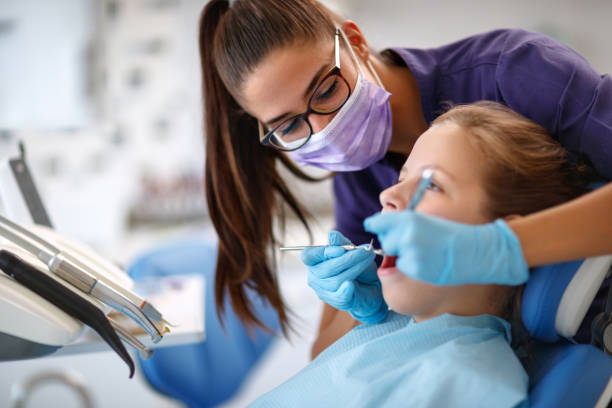 istock Dentist repairing child's tooth 966791522
