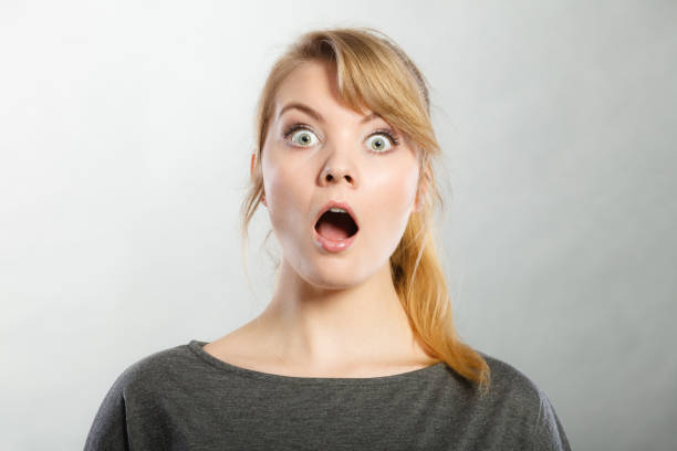 istock Surprised astonished girl with open mouth. 966791582